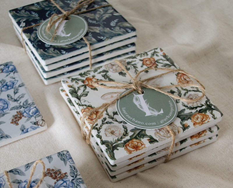 Set of floral coasters with string and tag on a light background